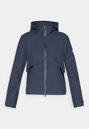 Marineblauer wasserdichter Mantel mit Reißverschluss vorne, verstellbare Kapuze, elastische Bündchen und Seitentaschen, mit einem Paneeldesign über der Brust.