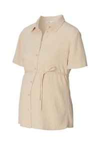 Kurzarm, cremefarbenes Umstandshirt aus strukturiertem Stoff, mit Kragen, Knöpfen vorne und einem gebundenen Taillendetail.