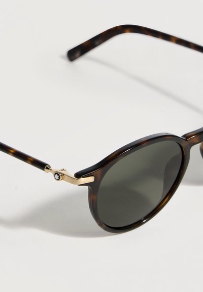 Στρογγυλά σκούρα γυαλιά ηλίου με σκελετό από καφετί μοτίβο χελώνας και χρυσούς μεταλλικούς μεντεσέδες, που διαθέτουν μια μικρή μαύρη διακοσμητική λεπτομέρεια στο μπράτσο.