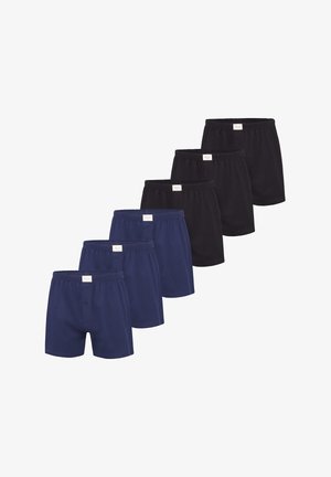 Set di boxer in cotone composto da quattro paia blu navy e quattro paia neri, con vita elasticizzata e patta con bottoni sui modelli blu navy.
