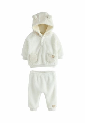 Fleece tvådelad set i off-white, med en huva som har björnosar, fickdetaljer på överdelen och resårmidja på byxorna.