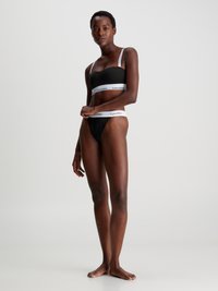 Calvin Klein Underwear LIGHTLY LINED BANDEAU ICON  - Modrček za pod majico - black