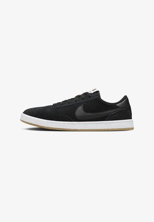 Black Nike sneakers with a suede upper, smooth black leather accents, white midsole, and gum rubber outsole. Classic lace-up design.