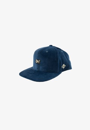 Dunkelblaues Cord-Baseballcap mit flachem Schirm, vorne mit gesticktem "Zephyr"-Logo und kleinem cremefarbenem Patch an der Seite.