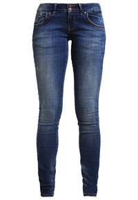 Mörkblå denim skinny jeans med en blekt tvätt. Har fem fickor, bältesöglor och en framknäppning. Slät textur.