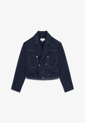 Navy cropped jacket with double-breasted front, orange stitching, two patch pockets, and a textured collar. Material is a blend of fabric styles.