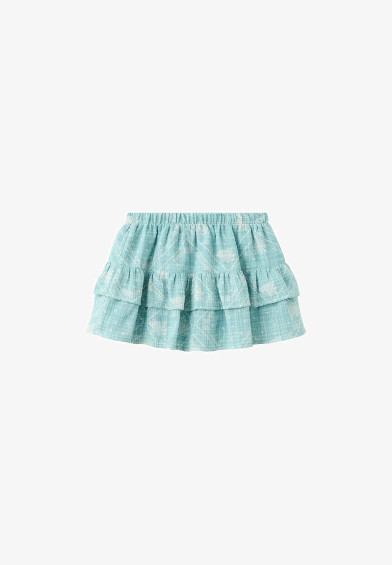 Mini-jupe à volants bleu clair avec imprimés floraux blancs et taille élastique, en tissu texturé.