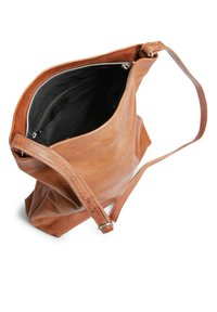 Brown leather tote bag with a single shoulder strap, top zipper closure, and a soft, unstructured shape. Interior is lined in black fabric.
