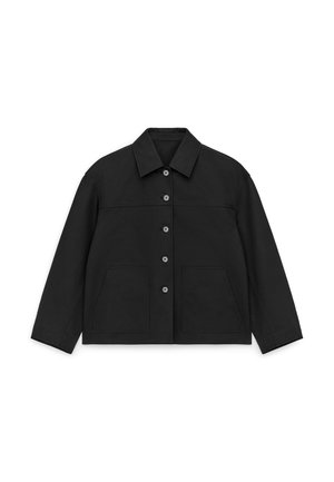 Black jacket made of durable fabric, featuring a button-front, spread collar, two front pockets, and long sleeves with a relaxed fit.