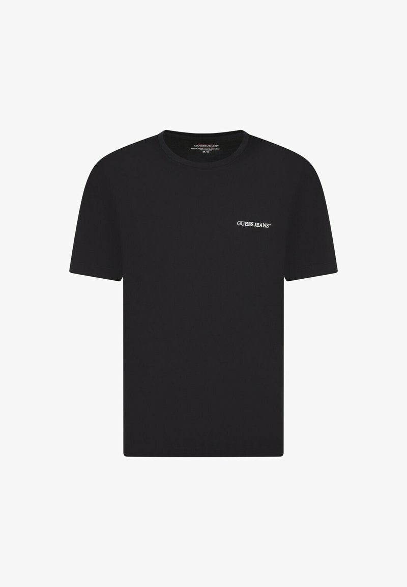 T-shirt en coton noir à manches courtes, col rond, avec un petit logo blanc "GUESS JEANS" sur la partie gauche de la poitrine. Texture lisse.