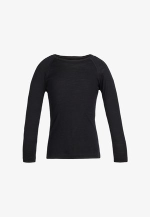 Chemise noire unie à manches longues et col rond, avec des coutures visibles le long des manches raglan, présentée sur un fond blanc.