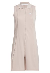 Hihaton beige urheilutakki, jossa on polo-collari, etuvetoketju ja hienovaraiset pleatit. Vasemmassa rinnassa pieni valkoinen logo.