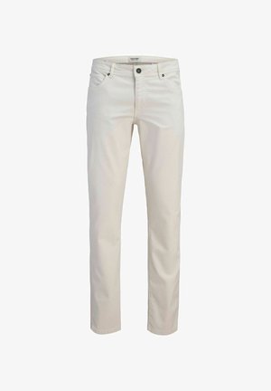 Kremkrāsas kokvilnas bikses ar taisnu piegriezumu, piecām kabatām un pogas aizdari. Tām ir klasiskas dizaina iezīmes ar minimālu šuvju daudzumu.