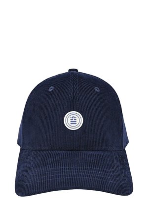 Casquette en velours côtelé bleu marine avec une couronne arrondie, une visière courbée et un logo blanc circulaire à l'avant. Tissu texturé avec des rayures verticales.
