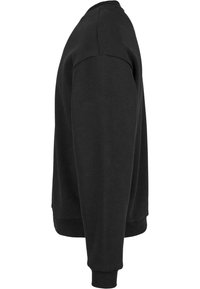 Schwarzer Pullover mit rundem Halsausschnitt, gerippten Bündchen und Saum, aus weichem Baumwollmischgewebe, mit einer lässigen Passform.