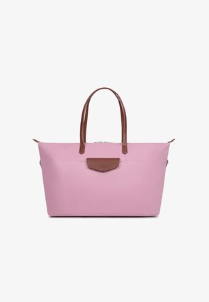 Lichtroze boodschappentas met bruine leren handvatten en een voorvak met klep, rechtopstaand op een witte achtergrond.