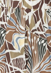 Multicolor fabric featuring abstract patterns in brown, green, blue, and cream tones. Smooth texture with pleated detailing.
