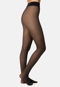 Black sheer tights with a polka dot pattern, smooth texture, and a wide waistband. Designed to fit snugly from waist to toe.