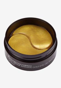 Patches de gel pour les yeux en or dans un conteneur rond noir, avec une texture lisse et brillante et une forme ergonomique pour une application sous les yeux.