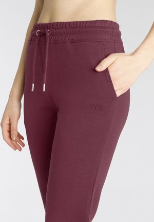 Bordeaux katoenen joggers met een elastische taille, trekkoord en zijzakken; voorzien van geborduurd "H.I.S" logo op de dij.