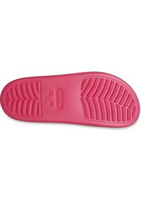 Plantilla de goma rosa con patrón de banda de rodadura texturizado. Presenta un prominente logo de la marca y la indicación de tamaño. Superficie lisa con ligera curvatura.