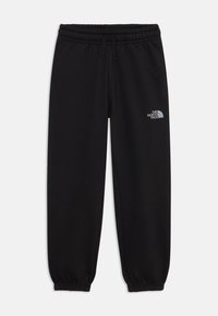 Svarta sweatpants i mjukt tyg, med elastisk midja, mudd och en reflekterande logotyp på vänstra låret.