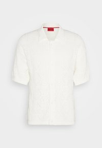 Witte gebreide cardigan met korte mouwen met diamanten patronen, een kraag en knoopsluiting. Gelaagdachtig stof met een geribbelde zoom en mouwen.