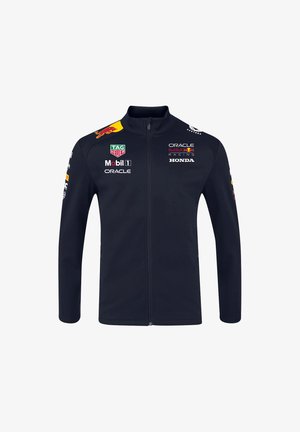 Granatowa kurtka na zamek z gładkiego materiału, z logo Red Bull Racing, Honda i TAG Heuer umieszczonymi na przodzie i rękawach.