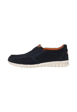 Navy slip-on shoe with a suede upper, elastic panels, contrasting stitching, and a white rubber sole. Brown leather accent at the heel.