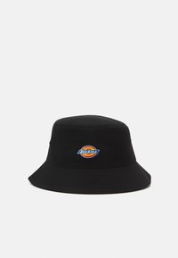 Black bucket hat made of fabric, featuring a circular Dickies logo patch in red, yellow, and blue on the front. Lightweight and structured design.