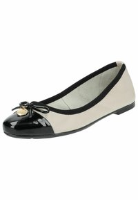 Ballet flat with a black patent toe, beige upper, black elastic trim, and a bow accent with a gold charm. Smooth texture throughout.