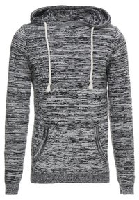 Sweatshirt mit Kapuze aus schwarzem und grauem Strickstoff mit strukturiertem Muster. Verfügt über eine Fronttasche und weiße Kordeln mit Quasten.