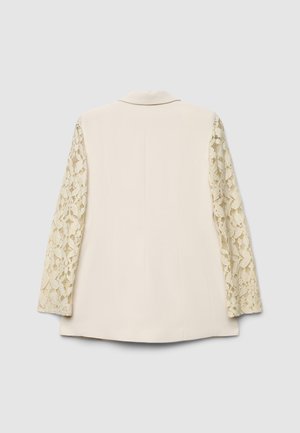 Beiger Blazer mit langen Spitzenärmeln, strukturiertes Blumenmuster auf der Spitze, strukturierte Form, einreihig, keine sichtbaren Verschlüsse am Rücken.