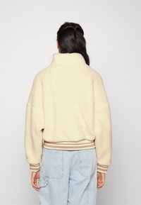 Karl Kani VARSITY TEDDY JACKET CREAM - Bomberjacka - cream