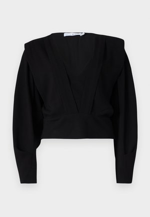 Blusa nera cropped con scollo a V profondo, maniche lunghe e spalle strutturate. Realizzata in un tessuto morbido e opaco con dettagli minimi.