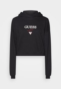 Sudadera corta negra hecha de un tejido suave, con el logotipo "GUESS" y acentos rojos, mangas largas y capucha con cordón.