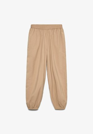 Beige loose-fit pants with elastic waistband and gathered elastic cuffs, displayed flat on white background.
