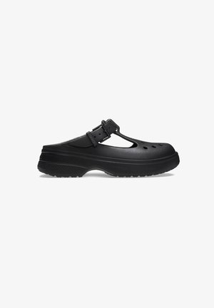 Black clog-style shoe made of durable synthetic material. Features a cutout design with ventilation holes and an adjustable strap. Textured sole.