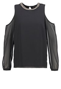Blouse noire épaules dénudées avec manches longues transparentes et encolure ronde ornée de perles argentées.