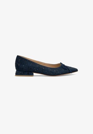 Navy blue ballet flats with pointed toe, perforated design, small block heel, and a decorative bow accent on the front.
