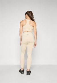 Casall SEAMLESS HIGH WAIST  - Tajice - ecru