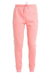 Rosa bomullsmunkbyxor med elastiskt midjeband och dragsko, med vita sidostråk och en liten logotyp på vänster ben.