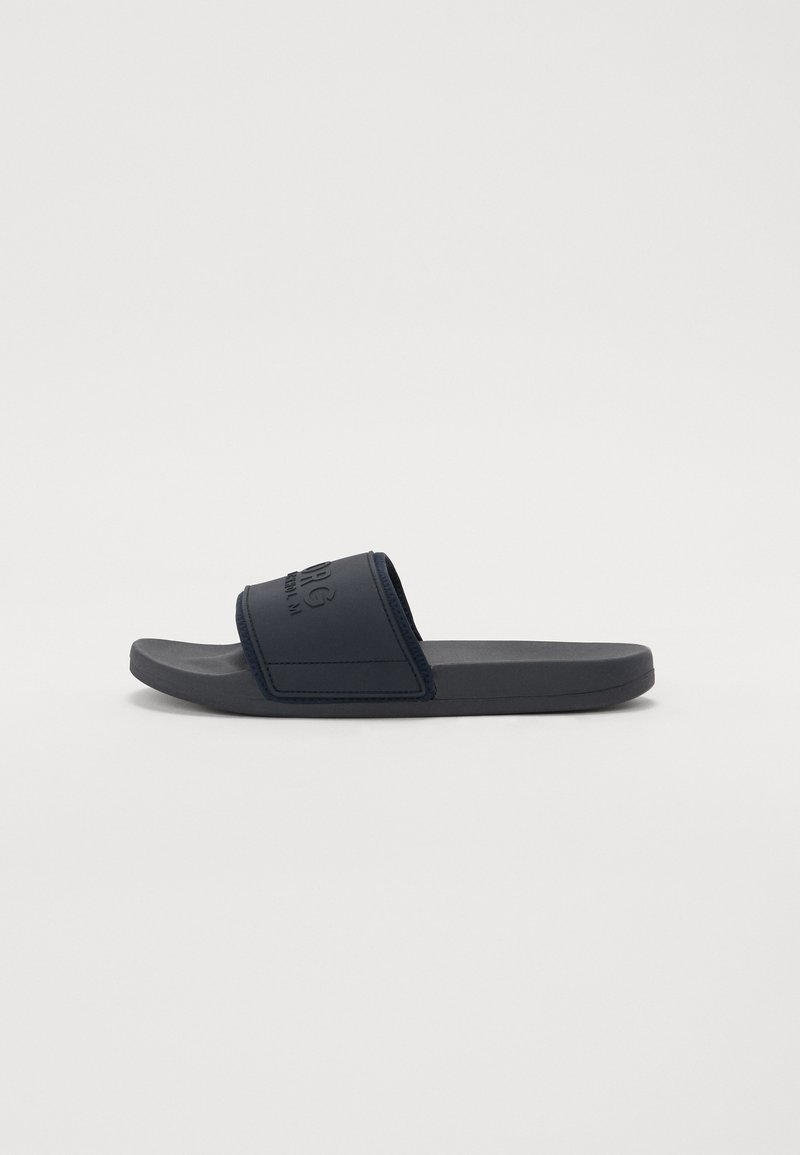 Navy slide sandal with a textured upper strap and smooth footbed; features a molded sole and subtle logo detail on the strap.
