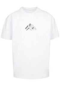 Witte katoenen t-shirt met een zwart berggraphic in het midden. Korte mouwen en een klassiek ronde halslijn ontwerp.
