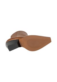 Stivale alla caviglia in pelle marrone con punta arrotondata, interno testurizzato e robusto tacco a blocco nero. La suola presenta un motivo a righe per un migliore grip.