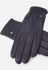 Purple leather gloves with a smooth texture, featuring ribbed details at the wrist and a logo accent on the side. Five-finger design.
