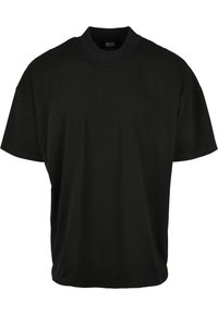 T-shirt noir à manches courtes avec un col rond, fabriqué en tissu doux, présentant une coupe décontractée et sans motifs ni accents visibles.