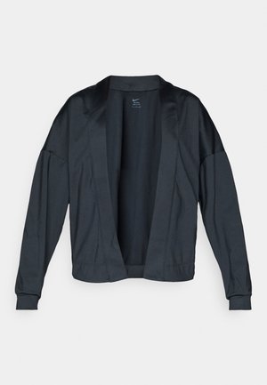 Melnā Nike jaka ar atvērtu priekšpusi, gariem piedurknēm un ribotiem aprocēm. Raksturo gluda, viegla auduma un minimālisma dizaina, bez aizdares.