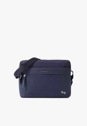 Petit sac bandoulière bleu marine compact avec une poche à fermeture éclair à l'avant, une sangle d'épaule réglable et le logo de la marque Hedgren sur le devant.