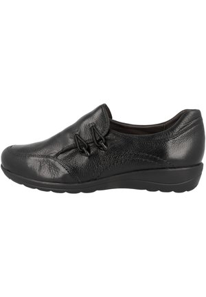 Schwarze Leder-Slipper mit niedrigem Keilabsatz und elastischen Seitenlaschen für einfaches Anziehen, entworfen für Komfort und legere Nutzung.